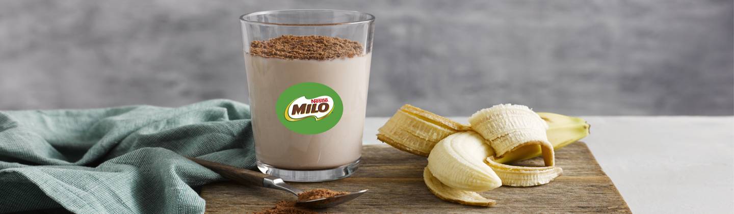 Glass of cold MILO and a banana.